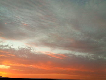 Low angle view of cloudy sky during sunset