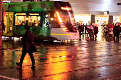 Blurred motion of people in city at night