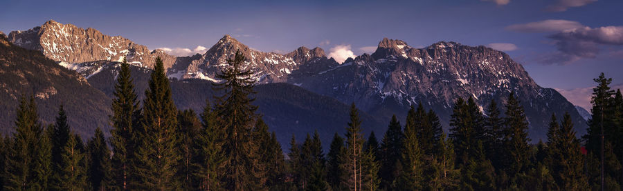 Panoramic view of snowcapped mountains against sky