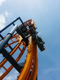 Low angle view of rollercoaster against sky