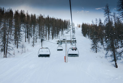 Ski lifts over snowy mountain