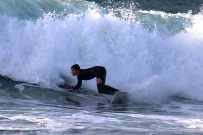 Man surfing in sea