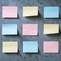 Blank colorful adhesive notes on wall