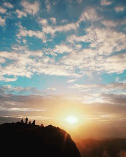 Silhouette landscape against sky during sunset