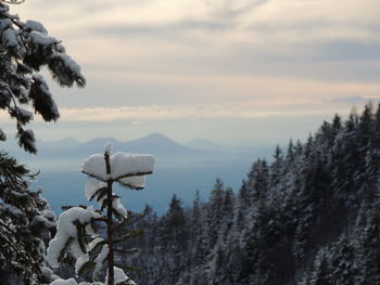 Scenic view of snow covered mountains against sky