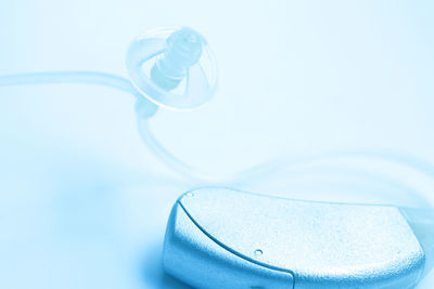 Close-up of hearing aid over white background