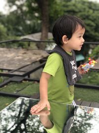 Cute boy standing outdoors