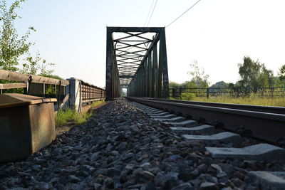 Surface level of railroad tracks against clear sky