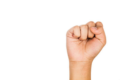 Close-up of person hand against white background