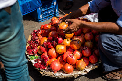 Low section of man for sale at market stall