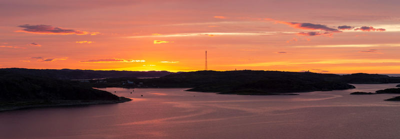 Colorful dramatic play of light and shadows at the sunset over the kola peninsula and barents sea