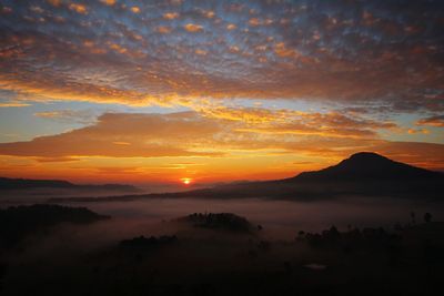 Scenic view of dramatic sky during sunset