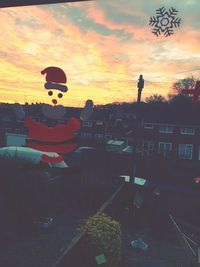 Silhouette person against sky during sunset