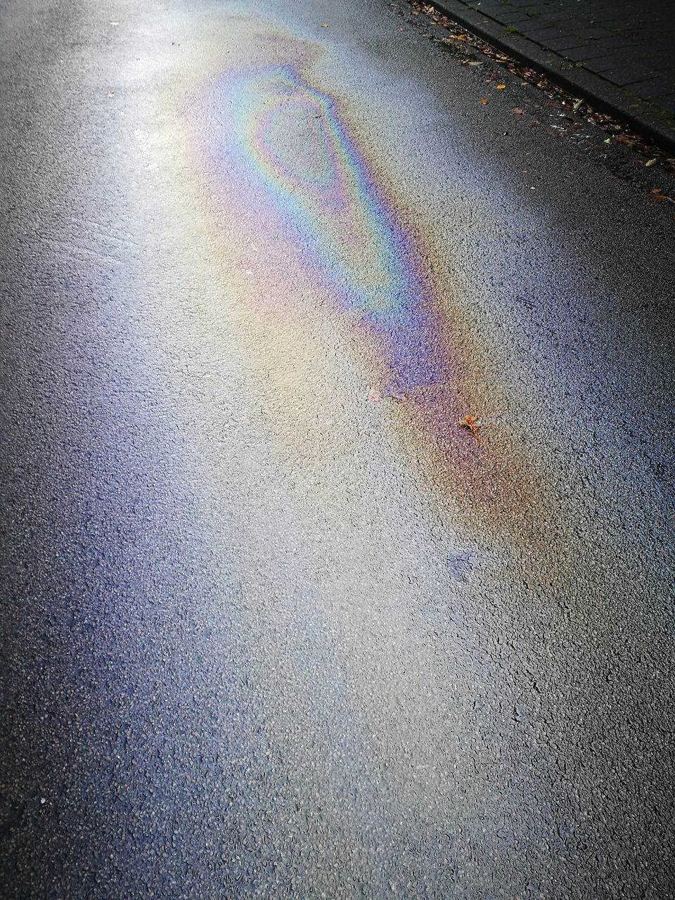 high angle view, oil spill, refueling, leaking, no people, road, asphalt, day, outdoors, close-up