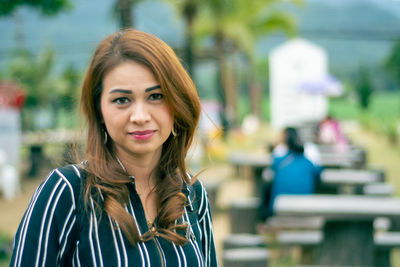 Portrait of woman standing outdoors