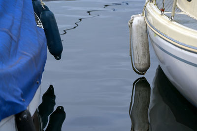 Low section of man on boat in lake