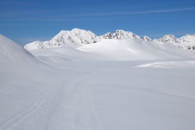 Alpine landscape in winter at alpe d'huez with the mountains covered in snow