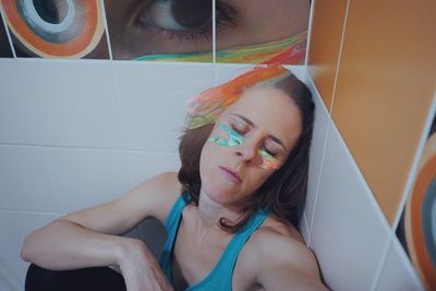 Portrait of beautiful young woman in bathroom