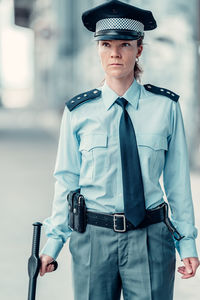 Portrait of mid adult man holding umbrella