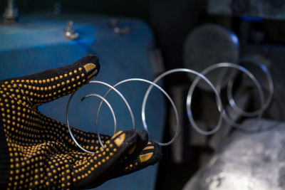 Cropped hand of person holding spring