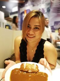 Portrait of a smiling young woman