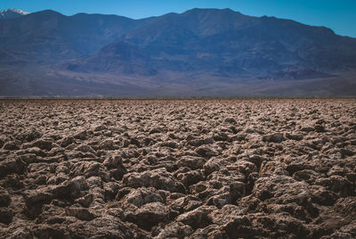 Scenic view of desert against mountain range