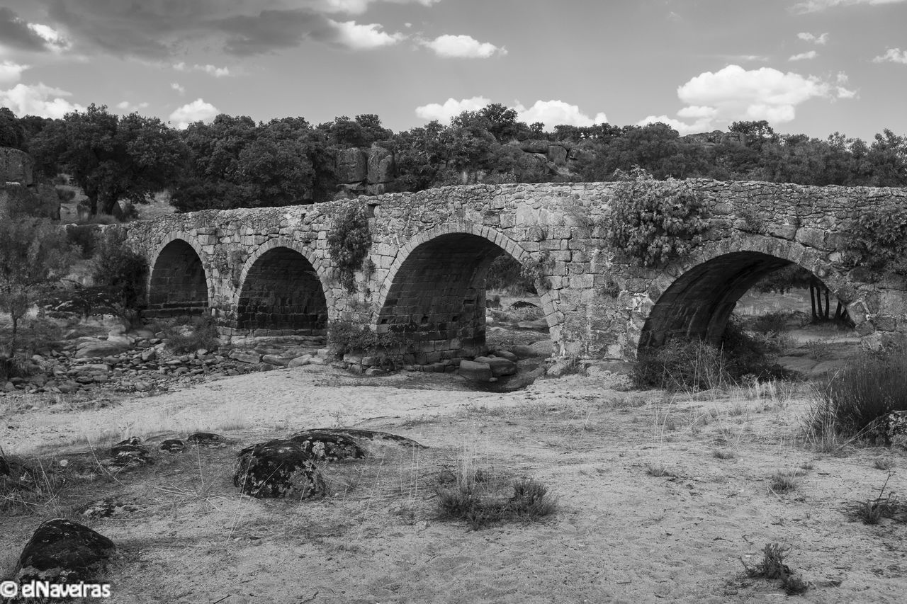 ARCH BRIDGE AGAINST SKY DURING AUTUMN