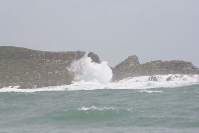 Waves splashing on rocks