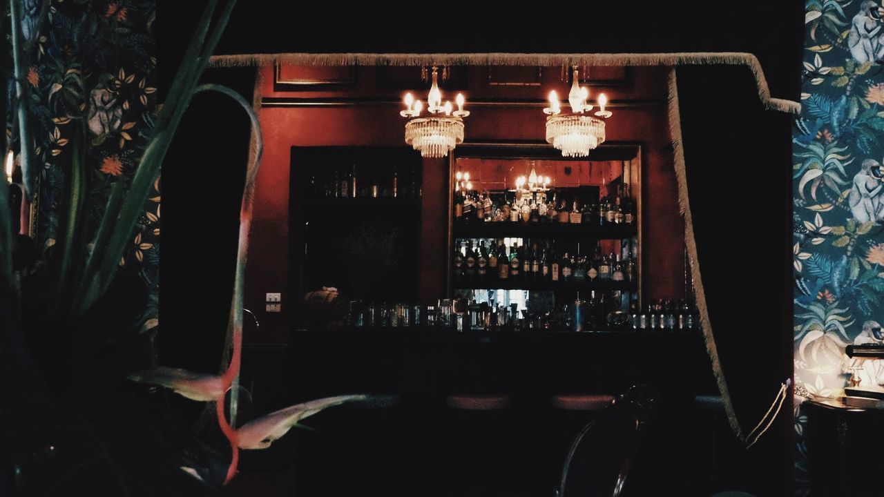 VIEW OF LIT CANDLES ON TABLE