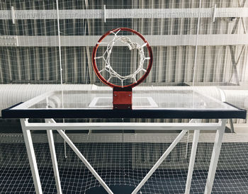 Directly below shot of basketball hoop at court