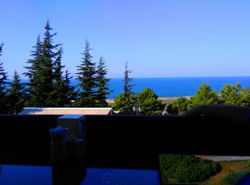 Swimming pool against clear blue sky