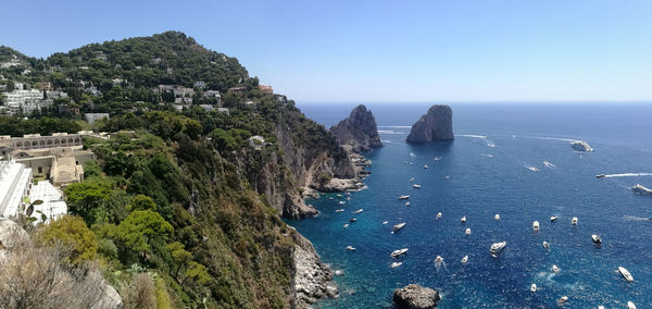 High angle view of sea against clear blue sky