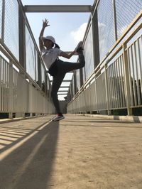 Low angle view of woman walking on staircase