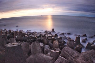 Scenic view of sea against sky at sunset