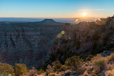 Scenic view of landscape against sky during sunset