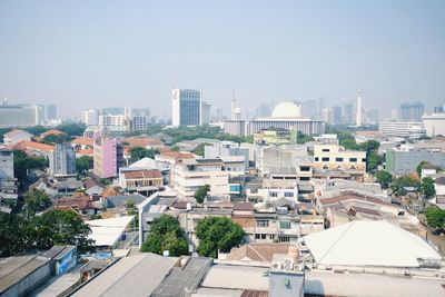 High angle view of buildings in city against sky