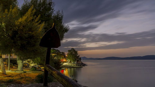 View of calm lake at sunset