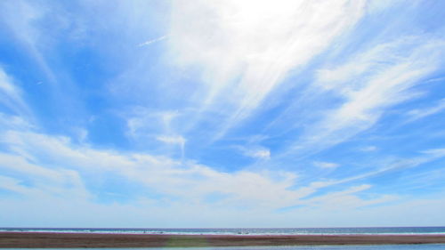 Scenic view of sea against blue sky