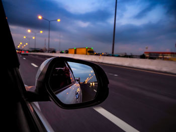 View of car on side-view mirror