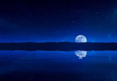Reflection of moon in river against star field at night