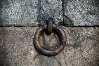 Close-up of rusty chain on wall