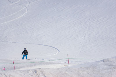 Man skiing on snowcapped mountain