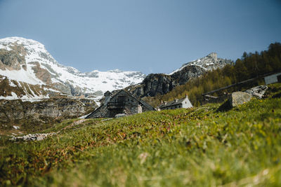 Scenic view of snowcapped mountains against clear sky