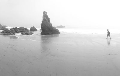 Scenic view of beach against clear sky