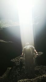 Woman standing in foggy weather
