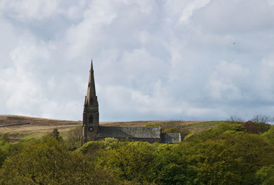 Historic building against cloudy sky