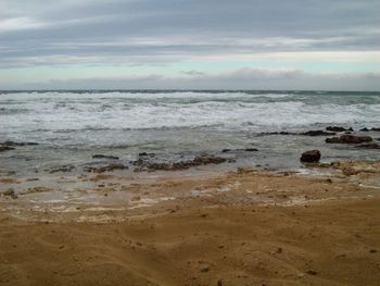 Scenic view of beach against sky