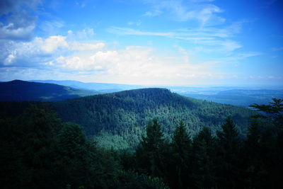 Scenic view of mountains against cloudy sky