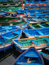 Fishing boats moored in blue water