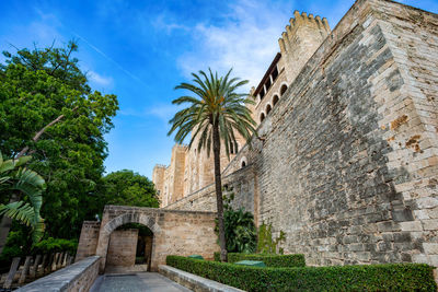 Low angle view of old ruins against sky